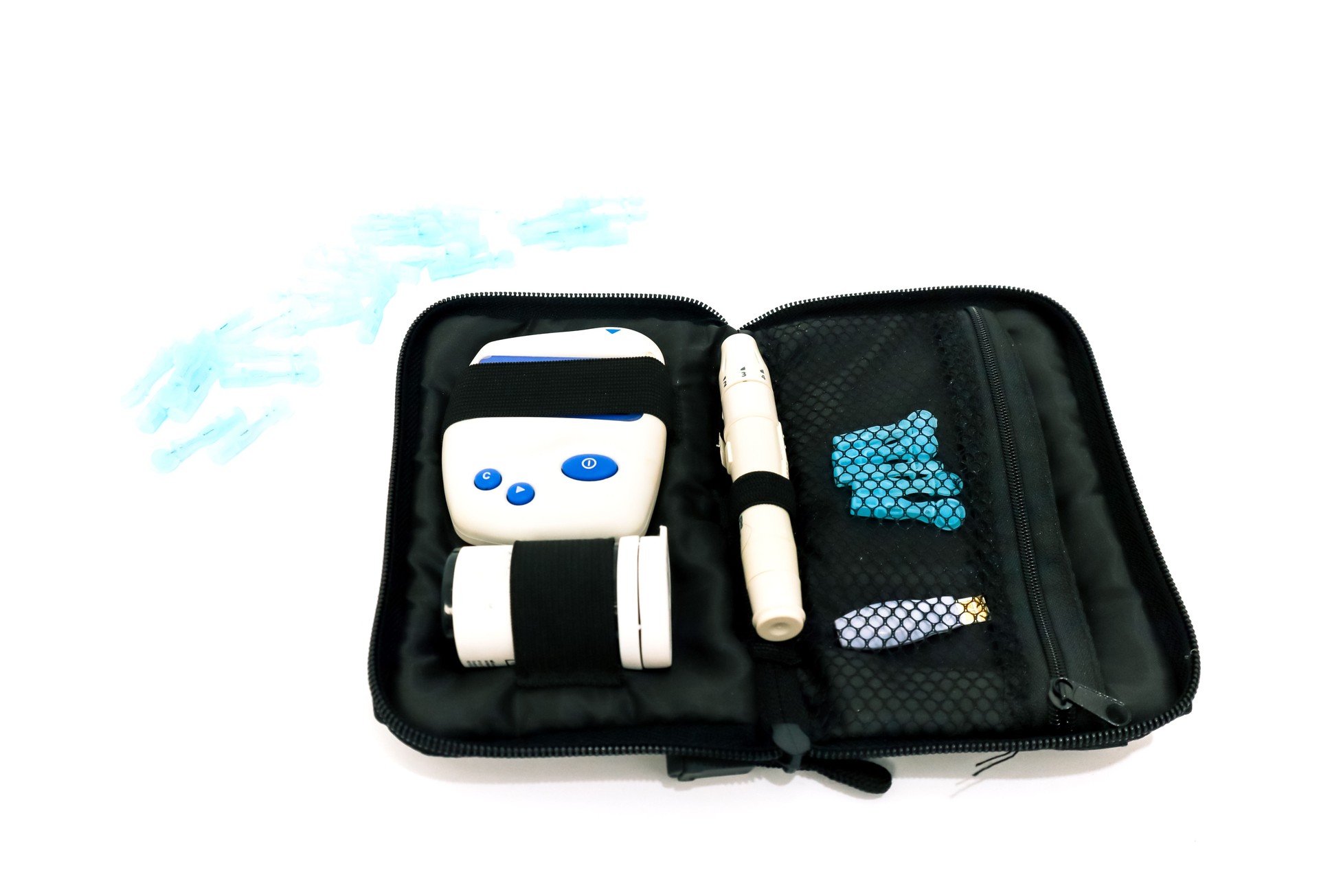 Comprehensive diabetes monitoring kit displayed against a pristine white backdrop, emphasizing healthcare and technology